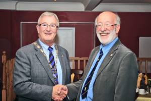 Gordon Sanders hands over the Presidency to Bill Munro